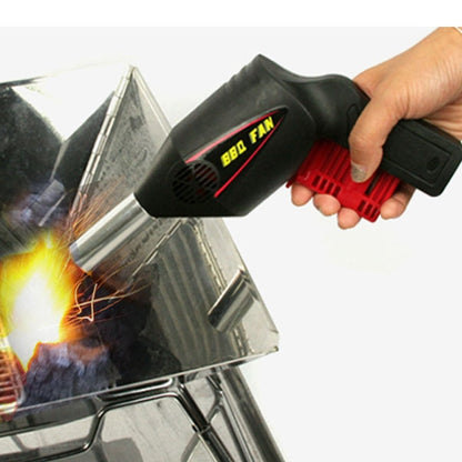 Handheld BBQ blower tool with black body, red vent, and metal air nozzle