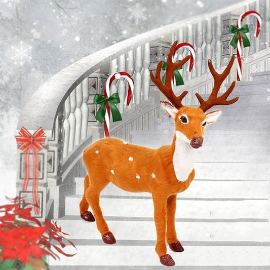 Simulated deer Christmas decoration: tall orange buck with white muzzle and branched antlers.