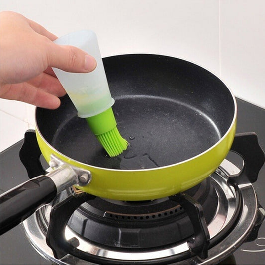Silicone oil brush attached to a squeeze bottle, with green bristles