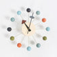 Wall clock with pastel blue ball arms, cream face, black hands and black clock marker