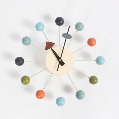 Wall clock with mint and dark ball arms, cream face, black minute and hour hands