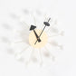 Wall clock with white ball arms, cream face, black hands and triangular pointer