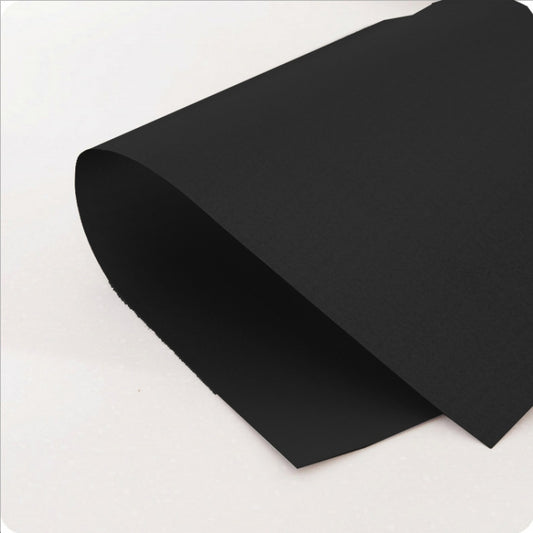 Black ultra-thin stovetop pad sheets, angled view