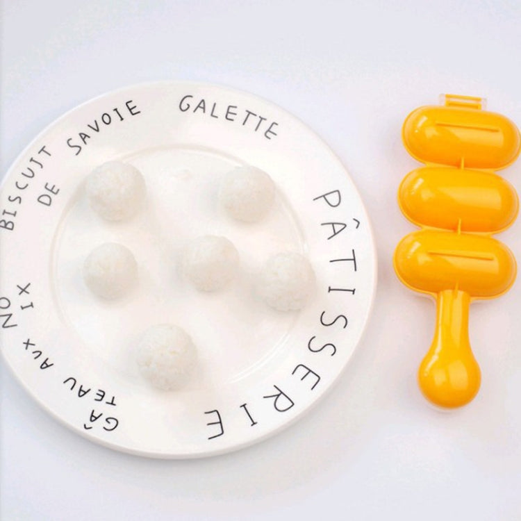 Orange spoon-shaped sushi rice ball mold holding four rice balls on a plate