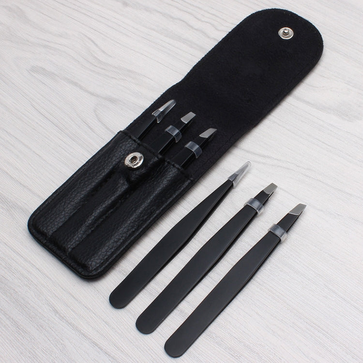 Black fabric pouch with two eyebrow scissors and one compact comb tool