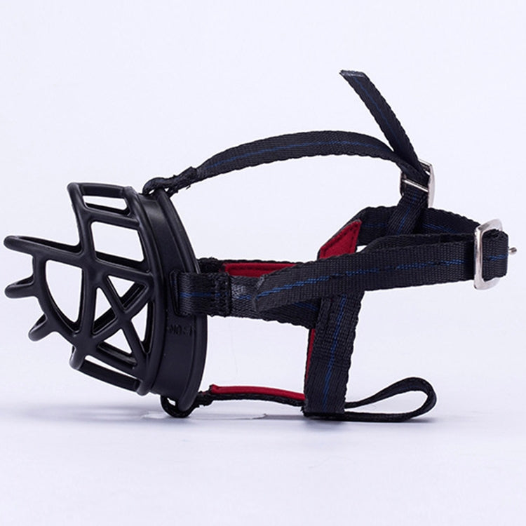 Black dog muzzle with wide blue strap and red inner padding, adjustable buckle