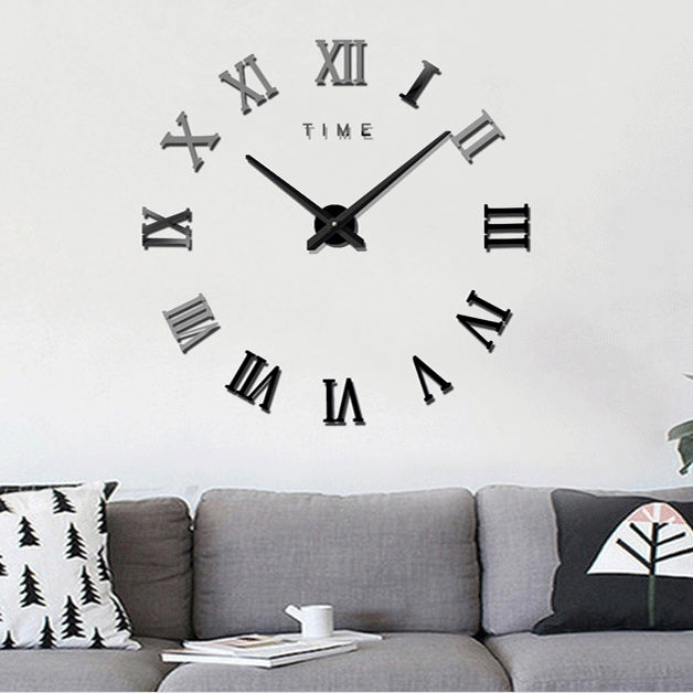 Black wall clock with Roman numeral markers and three-dimensional metal hands