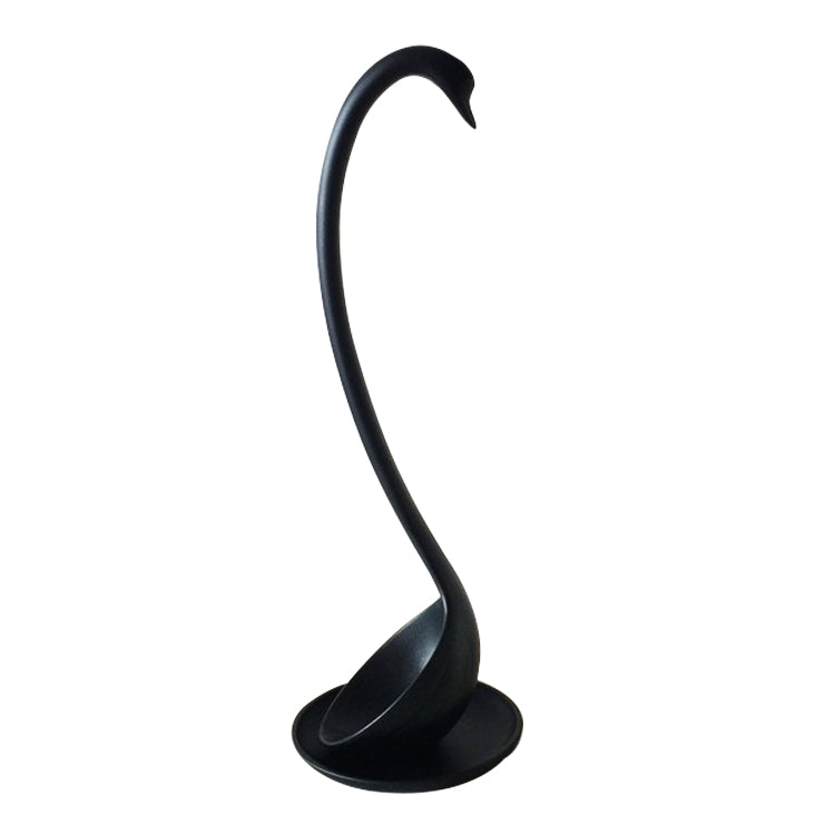 Black ladle stand with curved handle support and circular drip-tray base