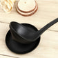 Black ladle stand with wide spoon rest tray and contoured bowl support