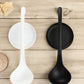 Two ladle stands in white and black, each with curved rest and round base