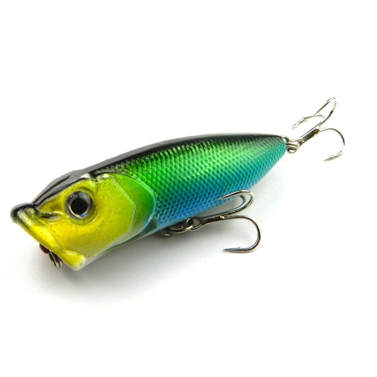 Green and blue plastic popper fishing lure with treble hooks.