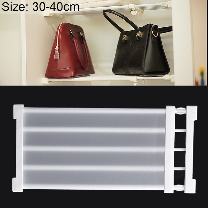 Layered baffle cabinet shelf with white rails and hooks holding handbags