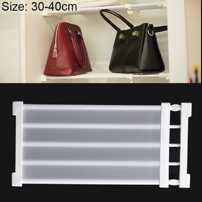 Layered baffle cabinet shelf with white rails and hooks holding handbags