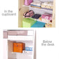 Adjustable wardrobe storage baffle shelf in a cupboard, organizing folded items