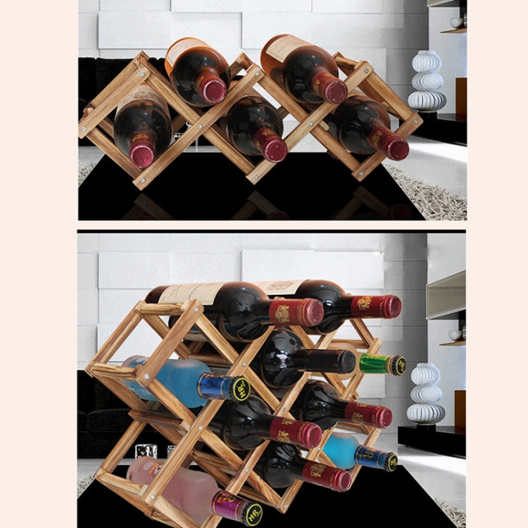Wooden foldable wine bottle rack with crisscross panels, displaying bottles