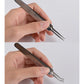 Acne pimple extractor tools held in hands, showing loop and fork tips