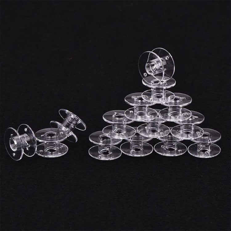 Clear plastic bobbin set with multiple spool holders and round base discs