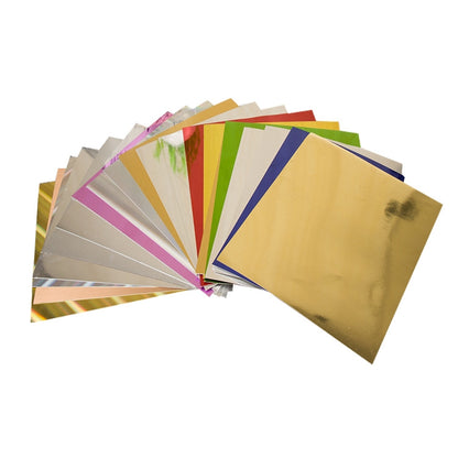 Assorted metallic foil paper sheets, various colors in A4 size stack