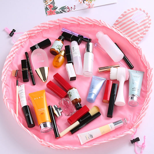Pink ruffled drawstring makeup pouch filled with assorted cosmetics and bottles
