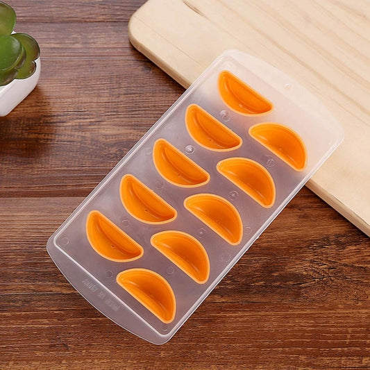 Orange silicone ice cube tray with orange molded cavities in clear plastic insert