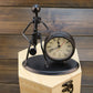 Retro small alarm clock with black metal figure frame and round cream Quartz dial