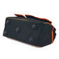 Black tool bag end panel with molded circular feet and orange piping