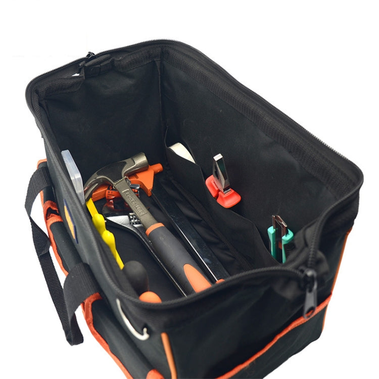 Open black interior of tool bag with elastic tool loops and zipper access pouch