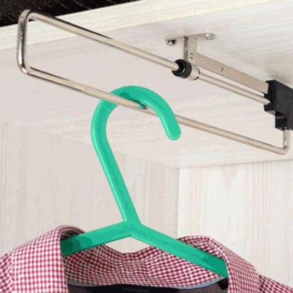 Telescopic wardrobe clothes rail with green hanger on chrome metal bar