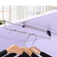 Telescopic wardrobe clothes rail with black end stops and wooden hangers