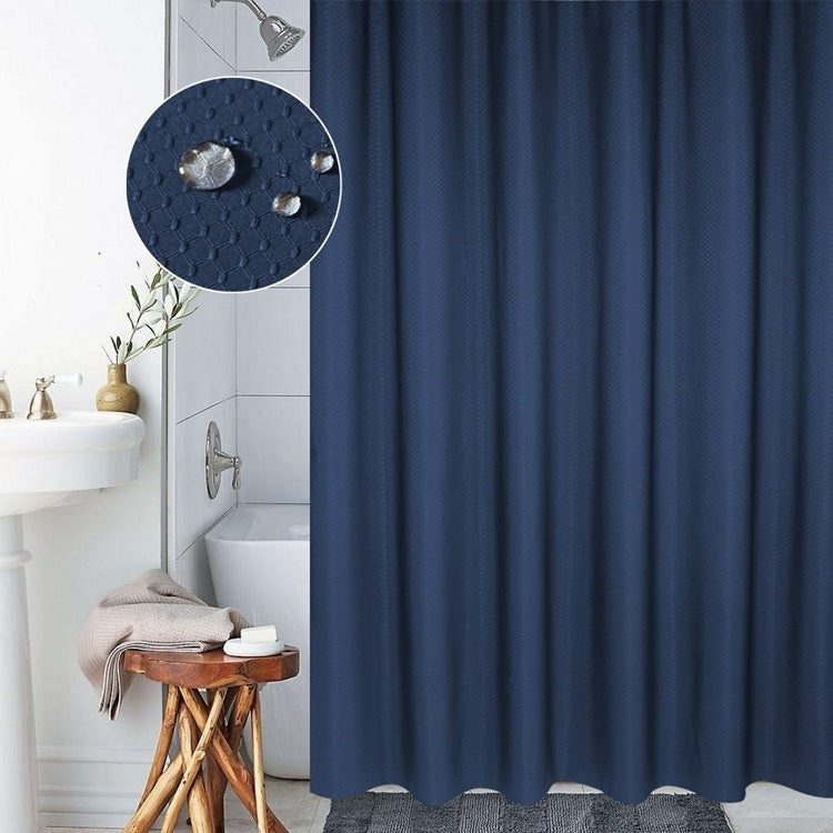 Dark blue shower curtain panel with honeycomb texture detail and top grommet holes