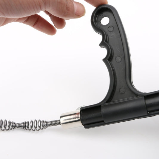 Drain auger nozzle with metal connector and coiled spring, shown in close-up