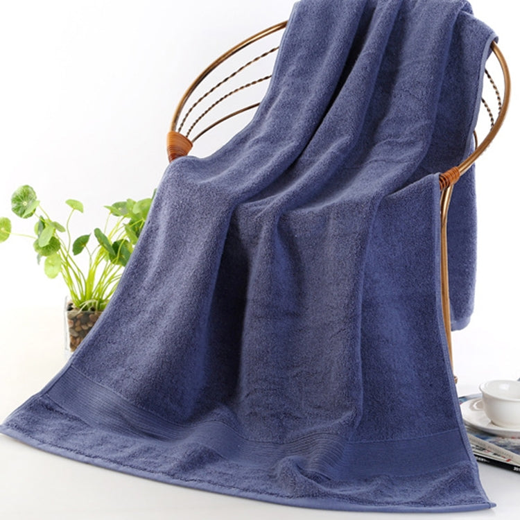 Thick navy blue cotton bath towel with soft looped terry pile