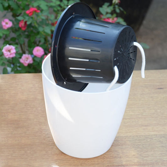 White self-watering planter pot with dark inner reservoir and visible cotton rope at the side