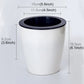 White circular resin self-watering planter with black rim, top opening—side view
