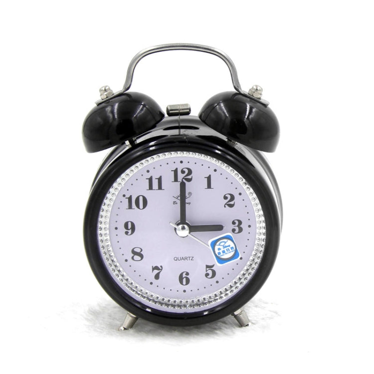 Black metal twin bell alarm clock with analog dial, quartz text, and blue night-light icon.