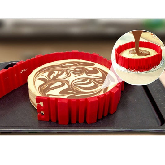 Red silicone cake mold holding a swirled cake; batter being poured into the cavity