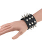 Black studded leather conical-tip spike bracelet with silver rivets on wrist
