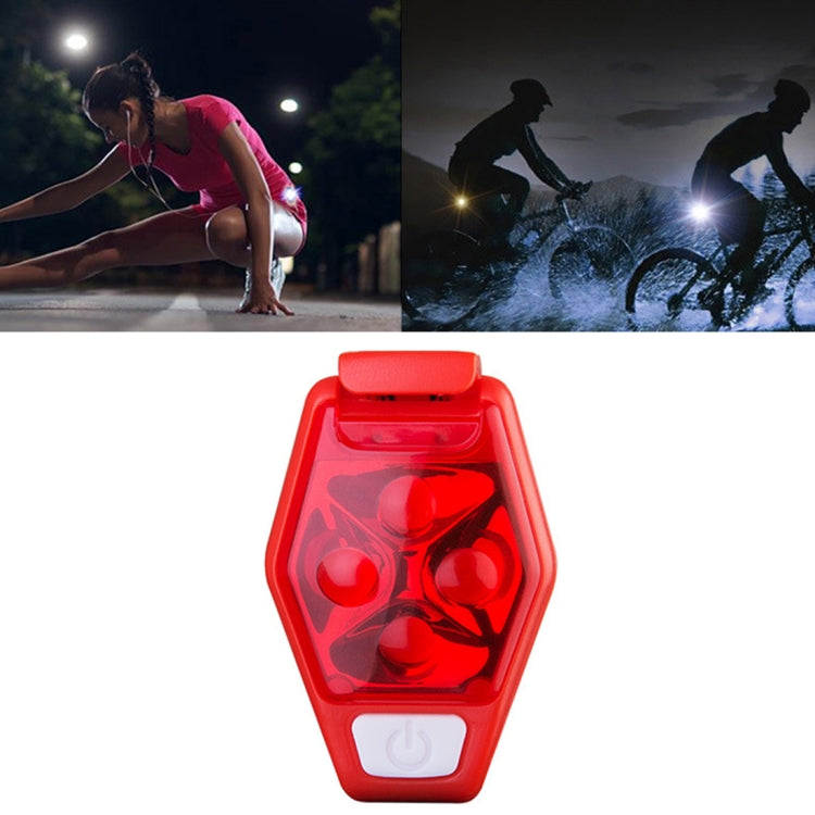 Red LED bike clip taillight, front view with four glowing light bulbs in red housing.