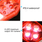 Red LED bike clip taillight close-up with four bright LEDs glowing behind clear lens.
