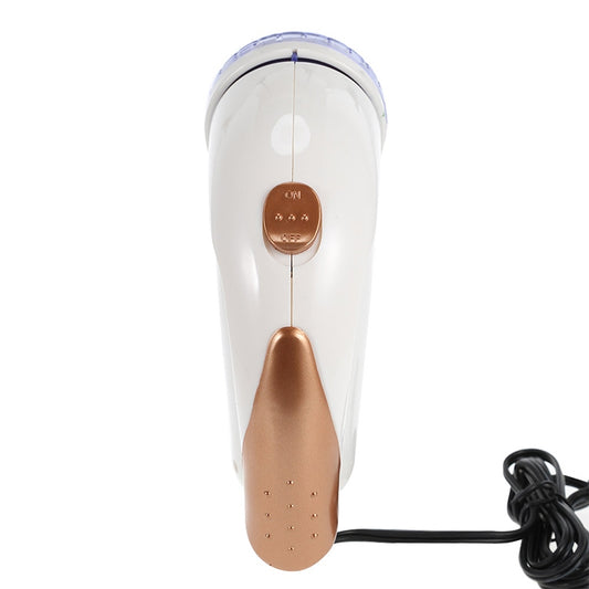 Electric fur ball trimmer with white body, copper-toned control area, and power cord