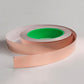 Copper conductive foil tape roll with a raised ribbon of tape extending from the spool