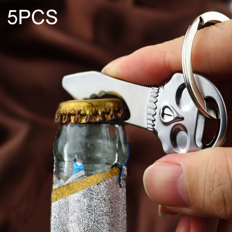 Skull-shaped bottle opener key chain with metal key ring and opener teeth