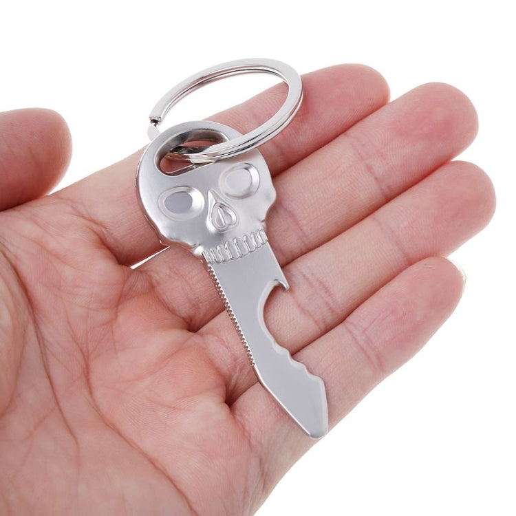 Skull bottle opener key chain in hand, silver metal with key ring loop