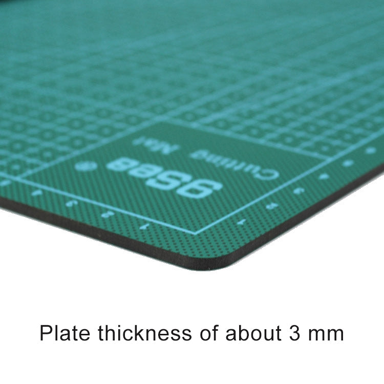 Close-up of A4 cutting mat corner with logo, dotted scale, and thick black edge
