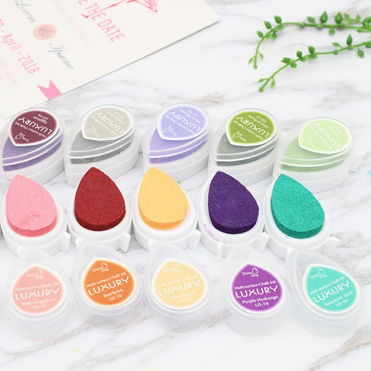 Colorful droplet-shaped ink stamp pads set with round lids and multiple shades