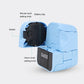 Blue robot alarm clock toy with open battery bay and setting knobs, side view