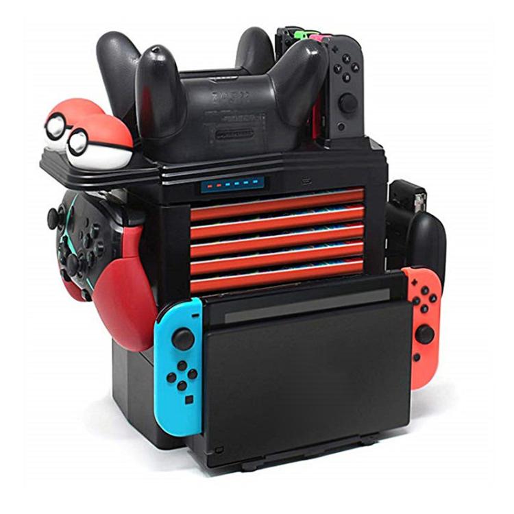 Game charging base stand with dual controller grips and red/blue Joy-Con holders