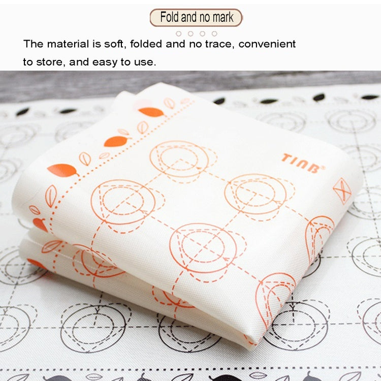 Macaron silicone baking pad, white folded with orange macaron pattern, compact storage