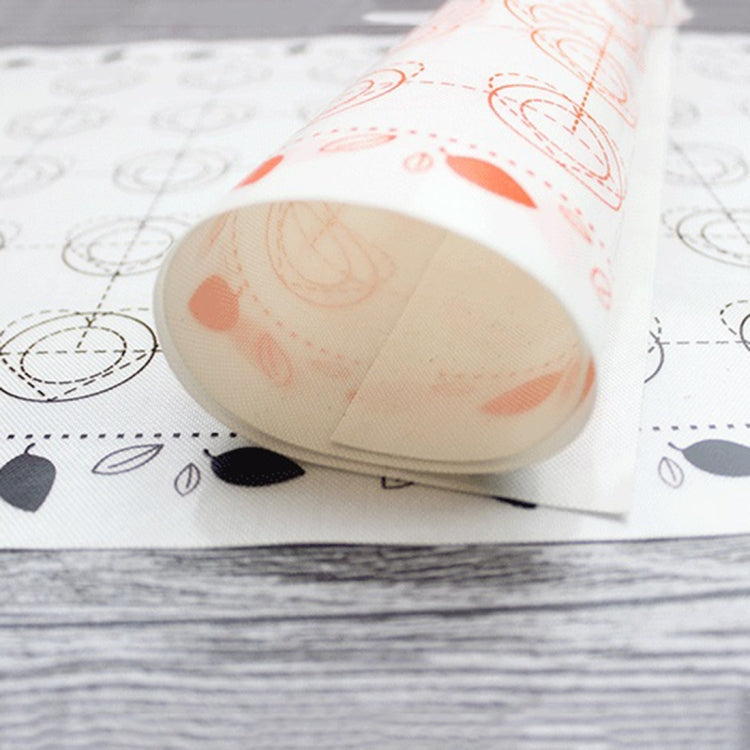 Rolled white baking mat with orange-red swirl and ring pattern