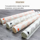 Rolled silicone baking mat with orange fruit prints and gray face pattern